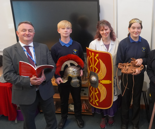 Principal Mr Walker, Samuel Evemy, science technician Ms Swinger and Georgiana Palmer at Latin club