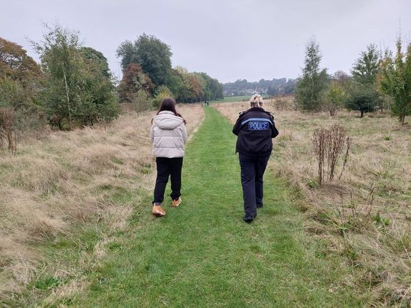 A policewoman and council worker litter picking in Gippeswk Park, Ipswich