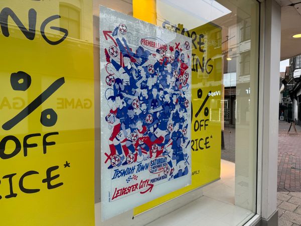 ITFC vs Leicester City poster in the window of the pop-up Sports Direct store