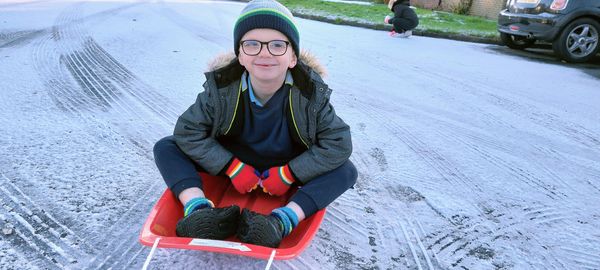 Harry Proctor made the most of the lightest of snowfalls as he took the sleigh to school in Capel St Mary