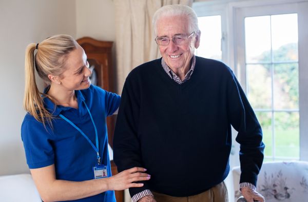 A care worker with an elderly man