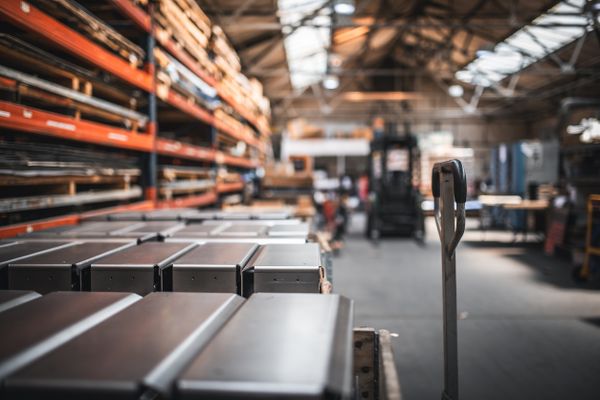 Finished product on a palets and raw material on shelves in a factory