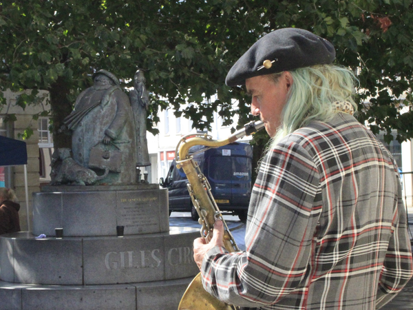 A busker performing in Ipswich town centre