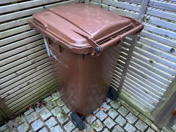 A brown garden waste bin