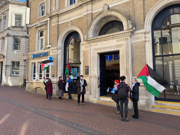 Eight demonstrators gathered outside Barclays Bank in Ipswich town centre today as part of a "Don't bank on apartheid" campaign