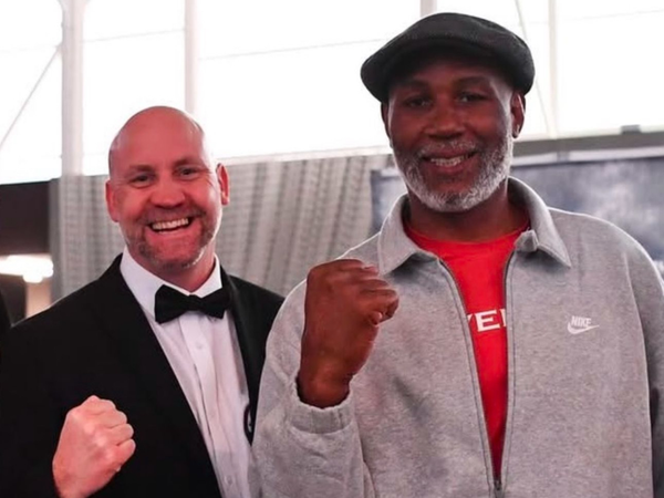 Simon Mullan with Lennox Lewis while refereeing at a tournament in Spain