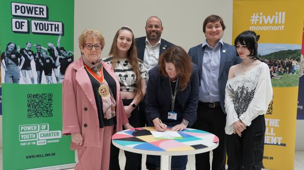 Bobby Bennett signing the Power of Youth Charter