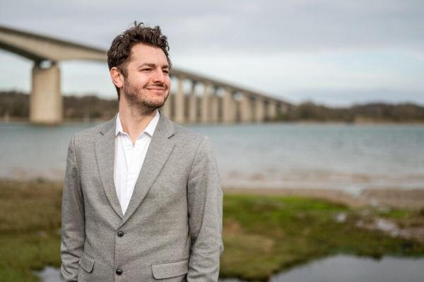 Ipswich MP Jack Abbott posing in front of the Orwell Bridge