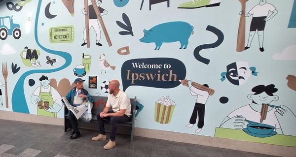 Security Manager Tyrone Candee on the chatty bench with a visitor