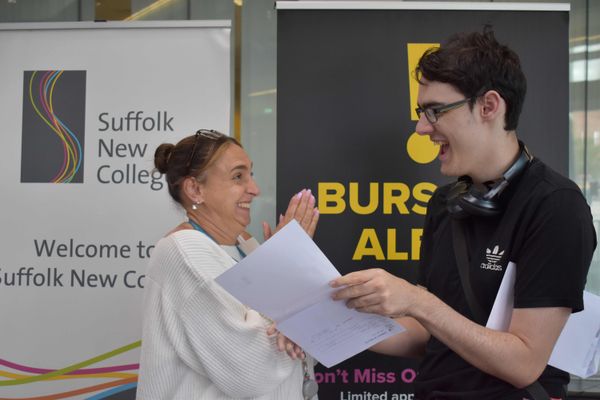 Cherese Tiller from Sufolk New College celebrates with Andrew Fitch, who passed his maths GCSE at the fourth time of asking