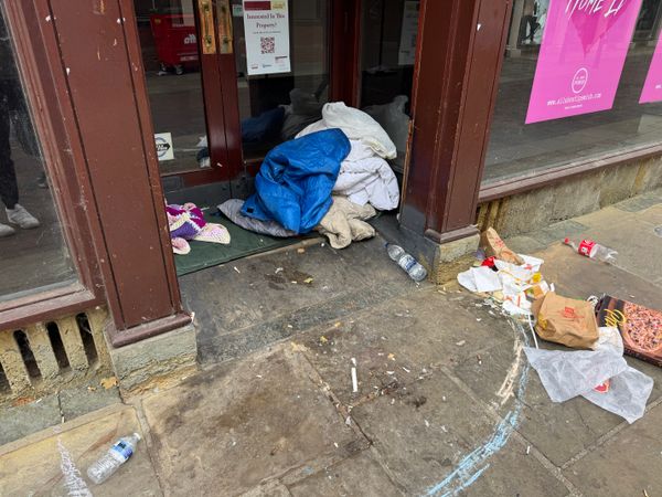A homeless person has set up camp at the former Edinburgh Woollen Mill store on Butter Market