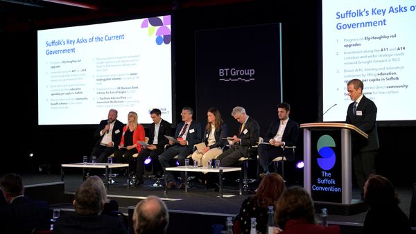 People sat on stage in a room