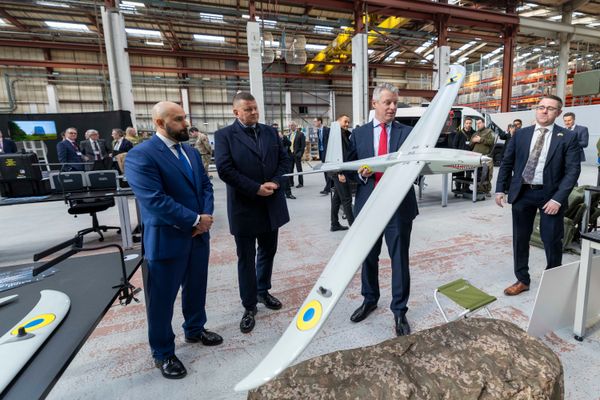 Minister for Defence Readiness and Industry Luke Pollard MP handling a Mini-Shark drone