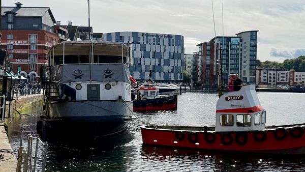 Onlookers watch as Mariners boat leaves Ipswich Waterfront