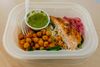 Chickpeas, sauce, and salmon sit in a tray at the Everytable in Flatbush.