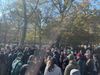 A crowd of around three dozen people gather on a cold sunny morning in Tompkins square park to discuss public safety.