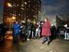 Councilmember Kristin Richardson Jordan holding a bullhorn, speaking at a rainy protest against the truck depot on the site o