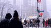 A NYC Midtown streetscape with snowfall.