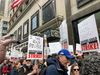 Striking writers hold signs and picket in Midtown.