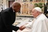 Mayor Eric Adams shakes Pope Francis's hand.