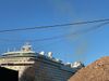 A cruise ship docked in Brooklyn belches toxic fumes.