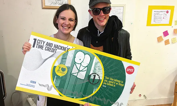Stik with Becky Booth of Spice, holding a time credit