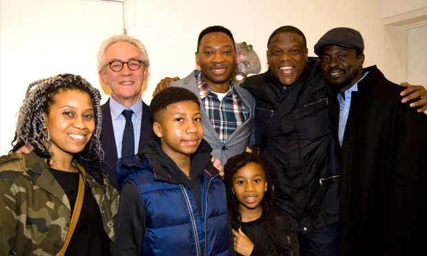 A triumphant Benjamin Ogbebor, his family, and Dr Robert Travers (2nd from left.)