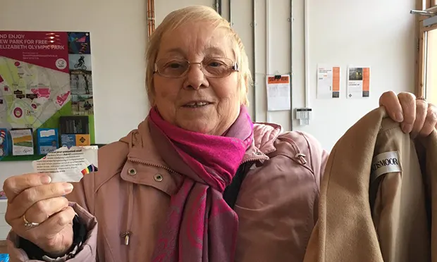 A woman donates an unwanted coat