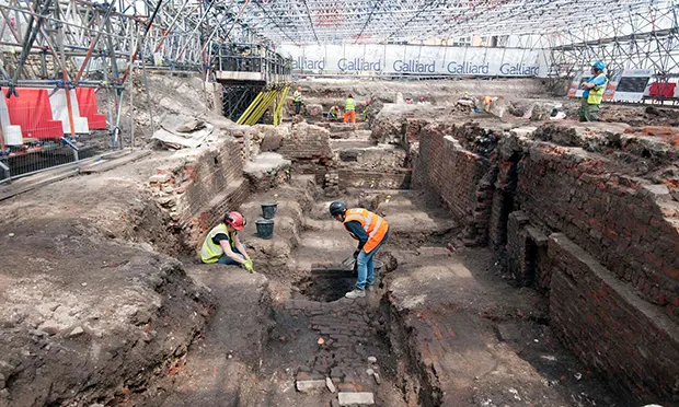 Archeologists excavating the site of The Curtain Theatre