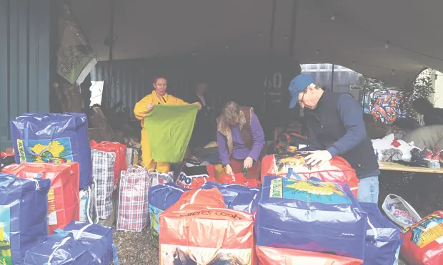 Helping hands: Lindsey Hood (left) and Andrew Marr (right) join Hackney Cypriot Association volunteers