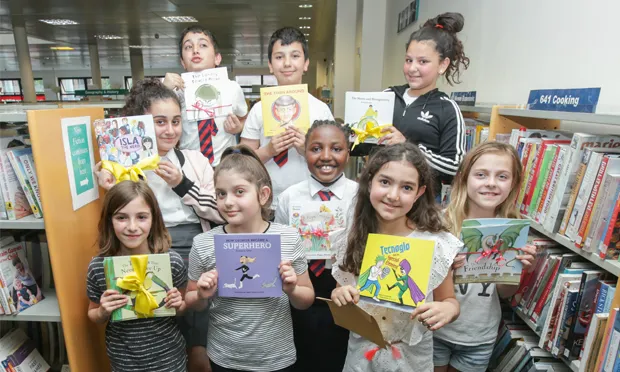 Picture perfect: the young authors pose with their creations at Shoreditch Library. Images: Penguin Random House UK