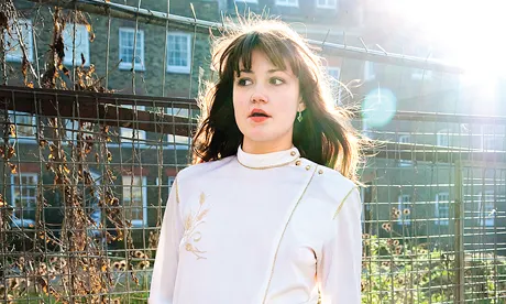 Rose wears vintage white dress with gold leaf thread-work