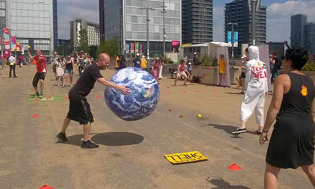 Campaigners stage ‘satirical’ dodgeball protest outside oil giant’s clean energy festival