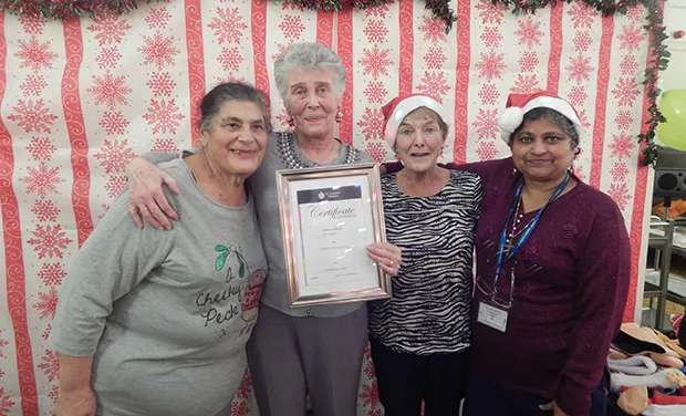 Sheila Bryant, a volunteer who received an award in December 2016 for 25 years service, pictured at a festive party alongside