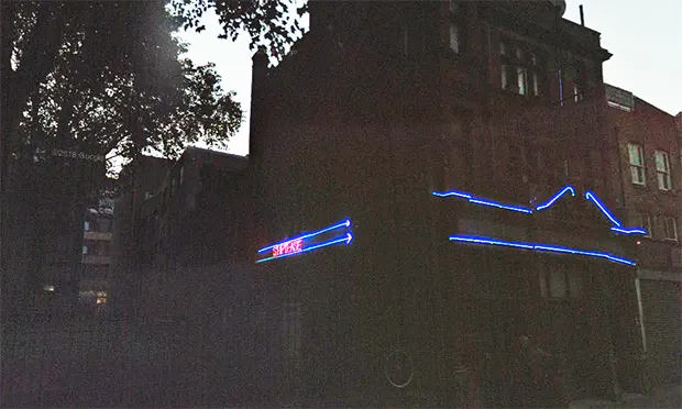 Ye Olde Axe’s licence renewed amid debate over neon ‘striptease’ sign
