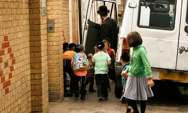 Pupils leave after the school day at Talmud Torah Machzikei Hadass. Photograph: Hackney Citizen
