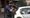 Armed police captured on video pointing assault rifles at two men holding their hands up