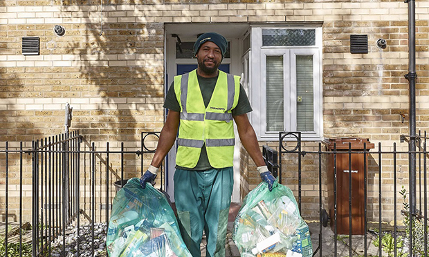 Council employee collecting recycling bags
