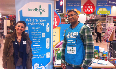 Hackney Food Bank's Liza Cucco (left) and a volunteer