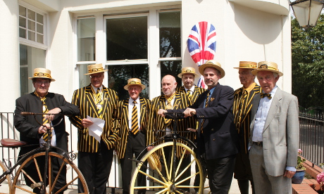 Pickwick members in front of plaque