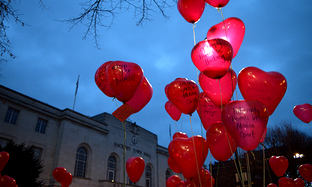 Red heart balloons outside the Town Hall