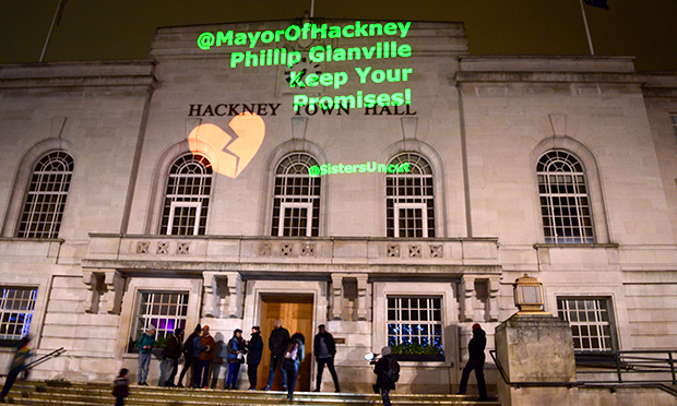 Sisters Uncut project message onto Town Hall