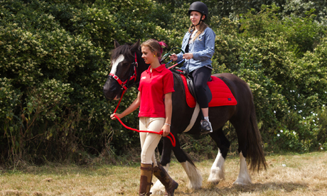 My not-so-little pony: Kalyeena Makortoff takes one of the trusty steeds for a spin at the Riding Centre