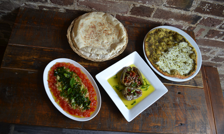 Makdoos, foul and mana'eesh with cheese and zataar served with Levantine bread
