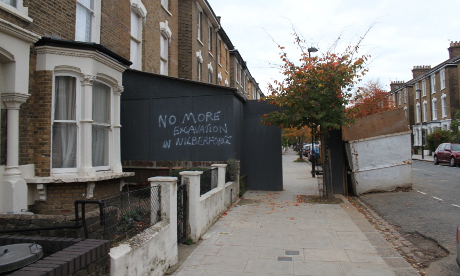 No more: Graffiti on the hoardings outside number 90. Photograph: Ella Jessel