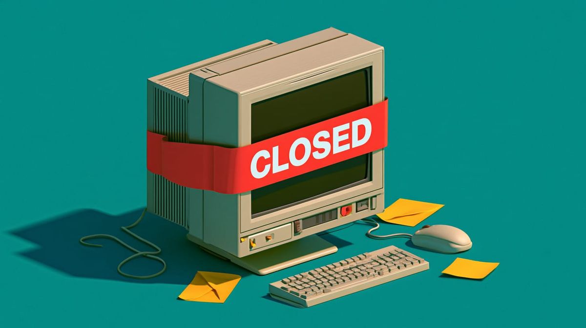 image of a computer with a "closed" sign attached