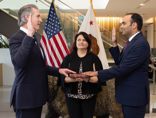 photo of Gov. Newsom swearing in Rohit Chopra