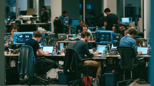 Researchers working in an AI lab