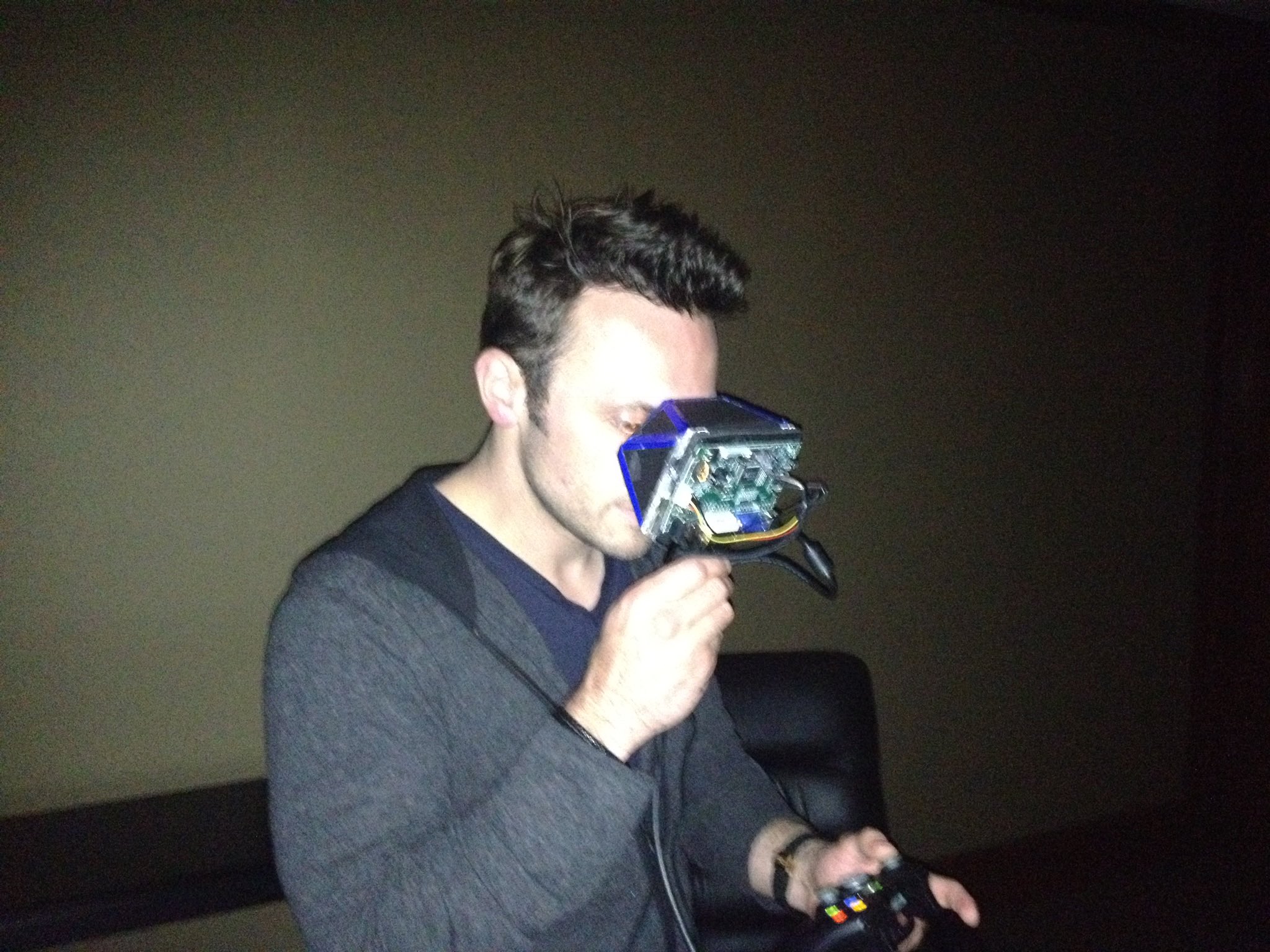 Oculus VR CEO Brendan Iribe looking at a Rift prototype in 2012.
