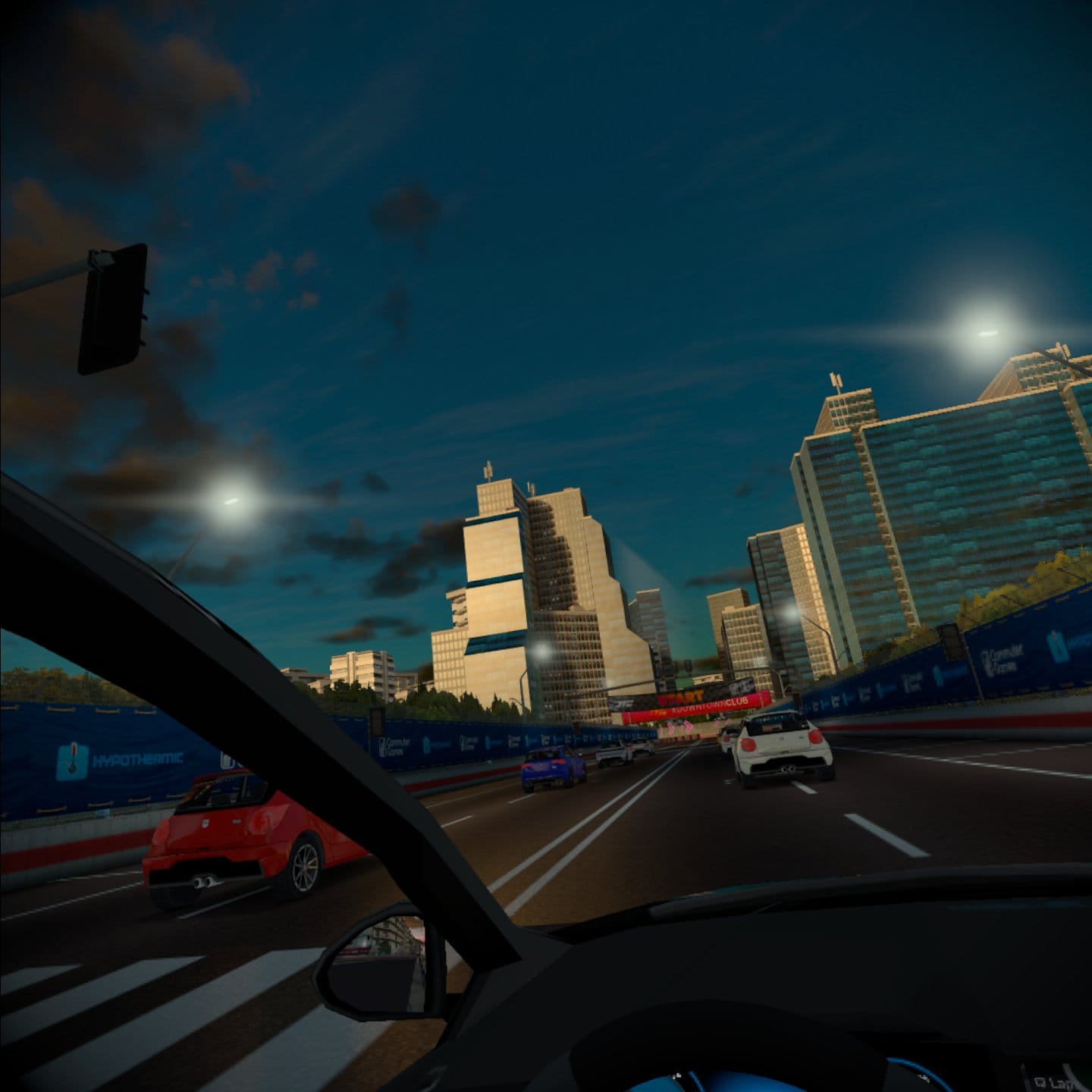 A downtown Club race at sunset. Cars line up at the starting grid.